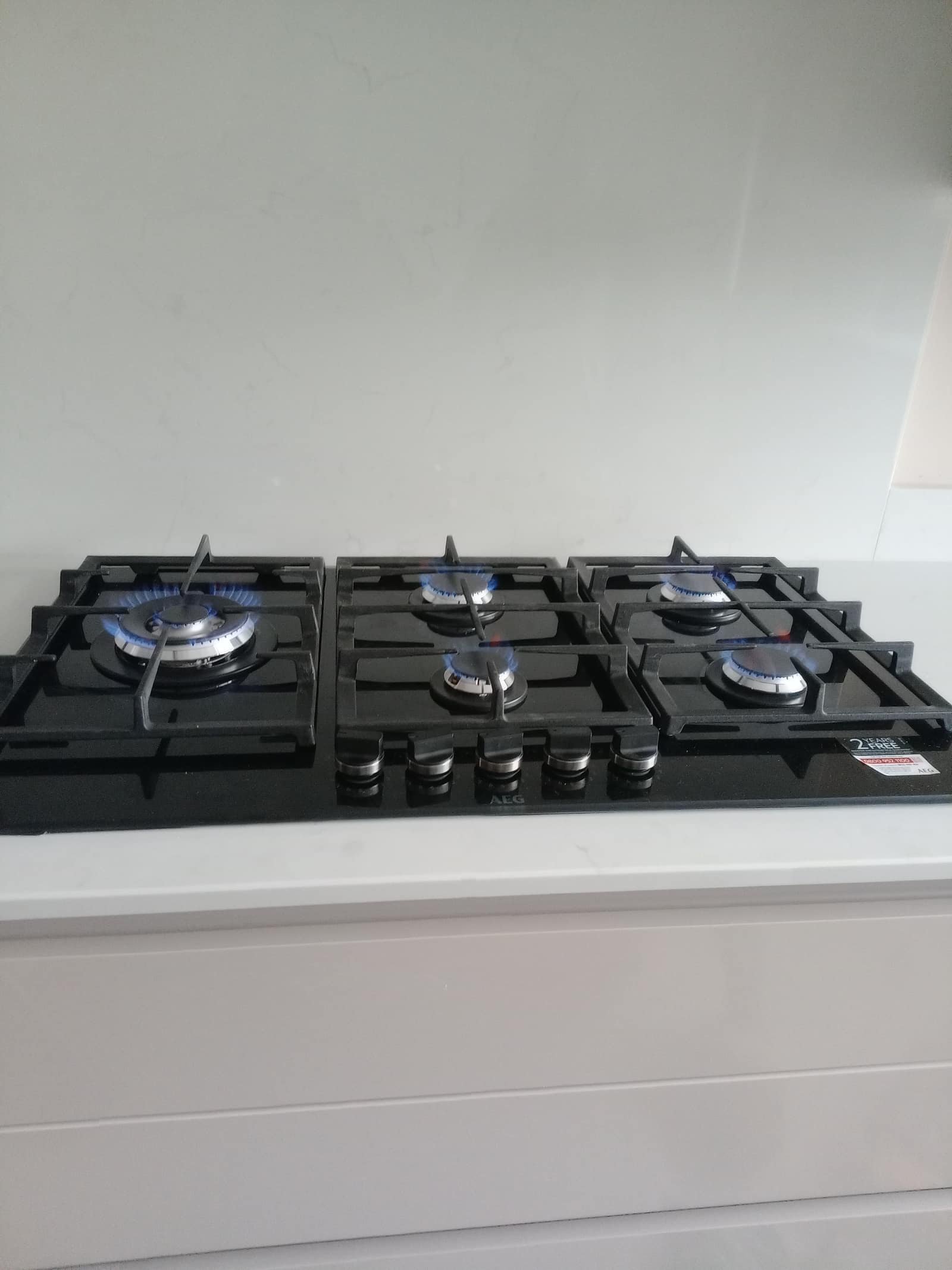 Gas cooker and hob fitting